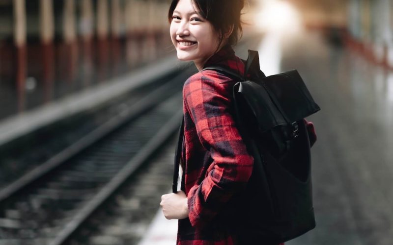 young-traveler-woman-looking-for-friend-planning-trip-at-train-station-summer-and-travel-lifestyle-1.jpg